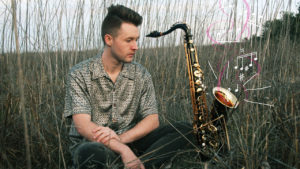 Eric Croissant with Tenor Sax in a field